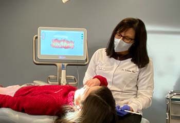 Dr. West treating a patient - West Family Orthodontics
